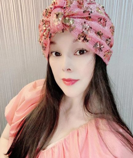 Green pom-pom sequined headscarf a bold and glamorous winter look